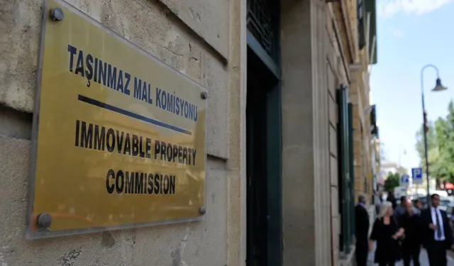 Rum Meclisi, "Göçmenlerin" TMK’ya başvurmaması için kurmayı hedeflediği fonu Bakan ile ele aldı